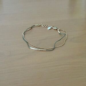 Layered string and chain bracelet